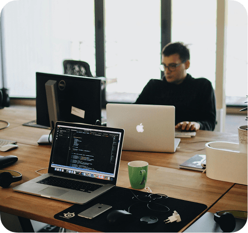 Person at a desk with a laptop